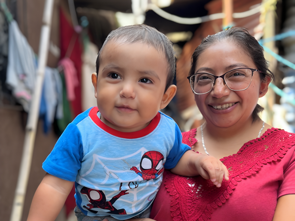Pregnant mother holding her child in Guatemala